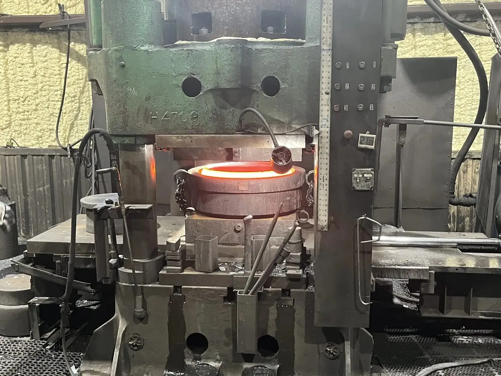 Forged and heat-treated alloy steel component resting on the MTS Forge shop floor